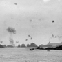日本軍の特攻隊の攻撃を受け、炎上する米軍の弾薬補給船。米軍側が撮影した＝１９４５年４月６日、沖縄県の慶良間諸島（沖縄県公文書館提供）